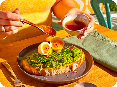 Avocado toast topped with a soft egg
