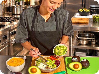Chef plating a fresh avocado dish